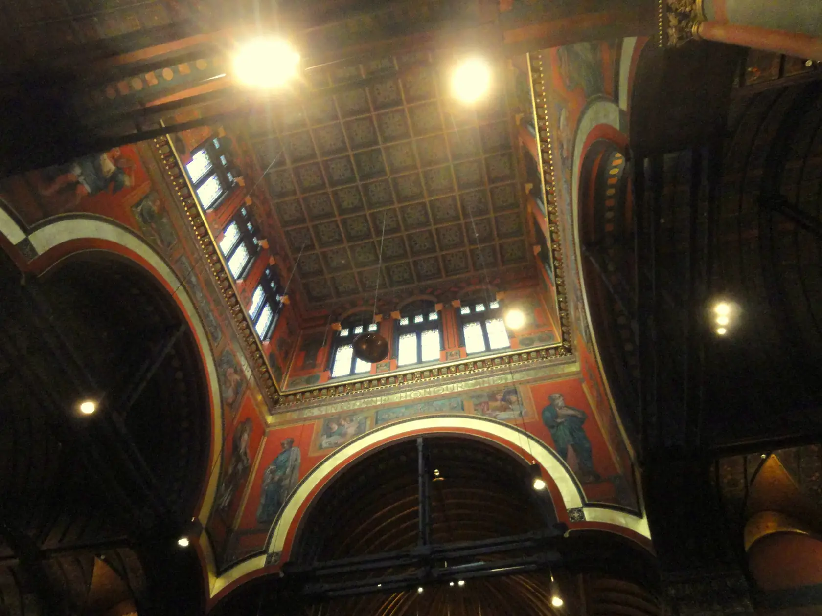 Interior of Trinity Church, Boston, looking up into the tower, where John La Farge’s murals surround a ring of windows.